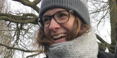 Portrait of Laura Glover, Copywriter wearing a coat, scarf and woolly hat