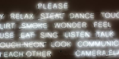 White neon words on a wall